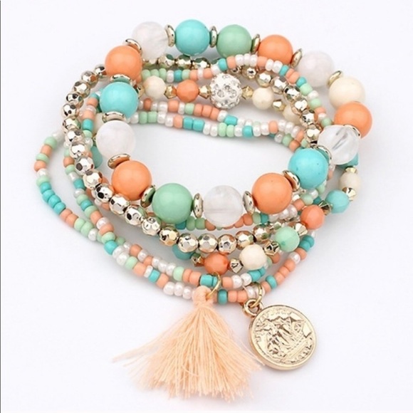 Justine’s Chic Boutique Jewelry - 6 Stretch Layering Bracelets Charm & Tassel Detail